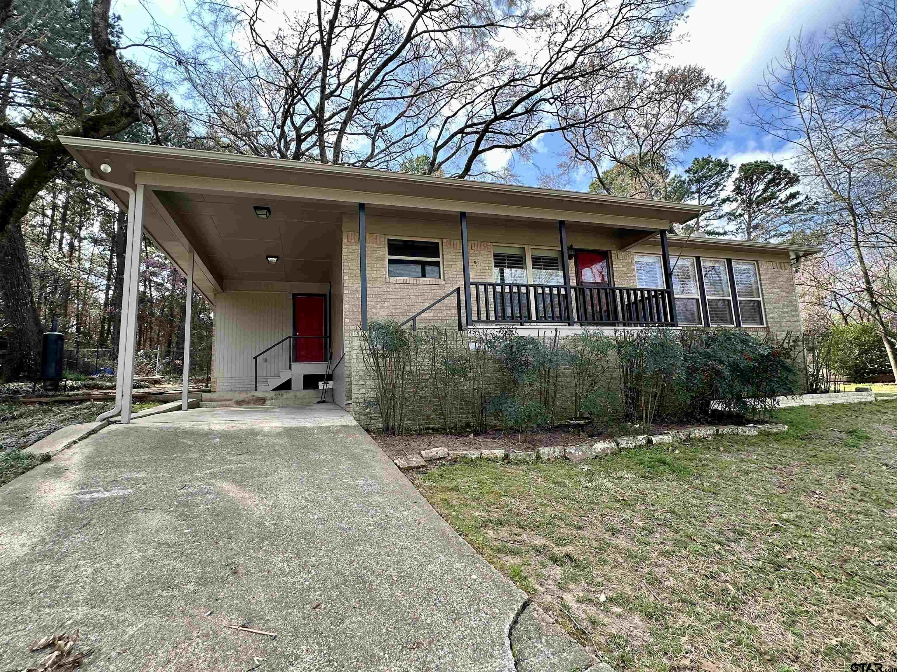 17035 Deer Run Road Flint, TX 75762 - Photo 2 of 31 a front view of a house with garden