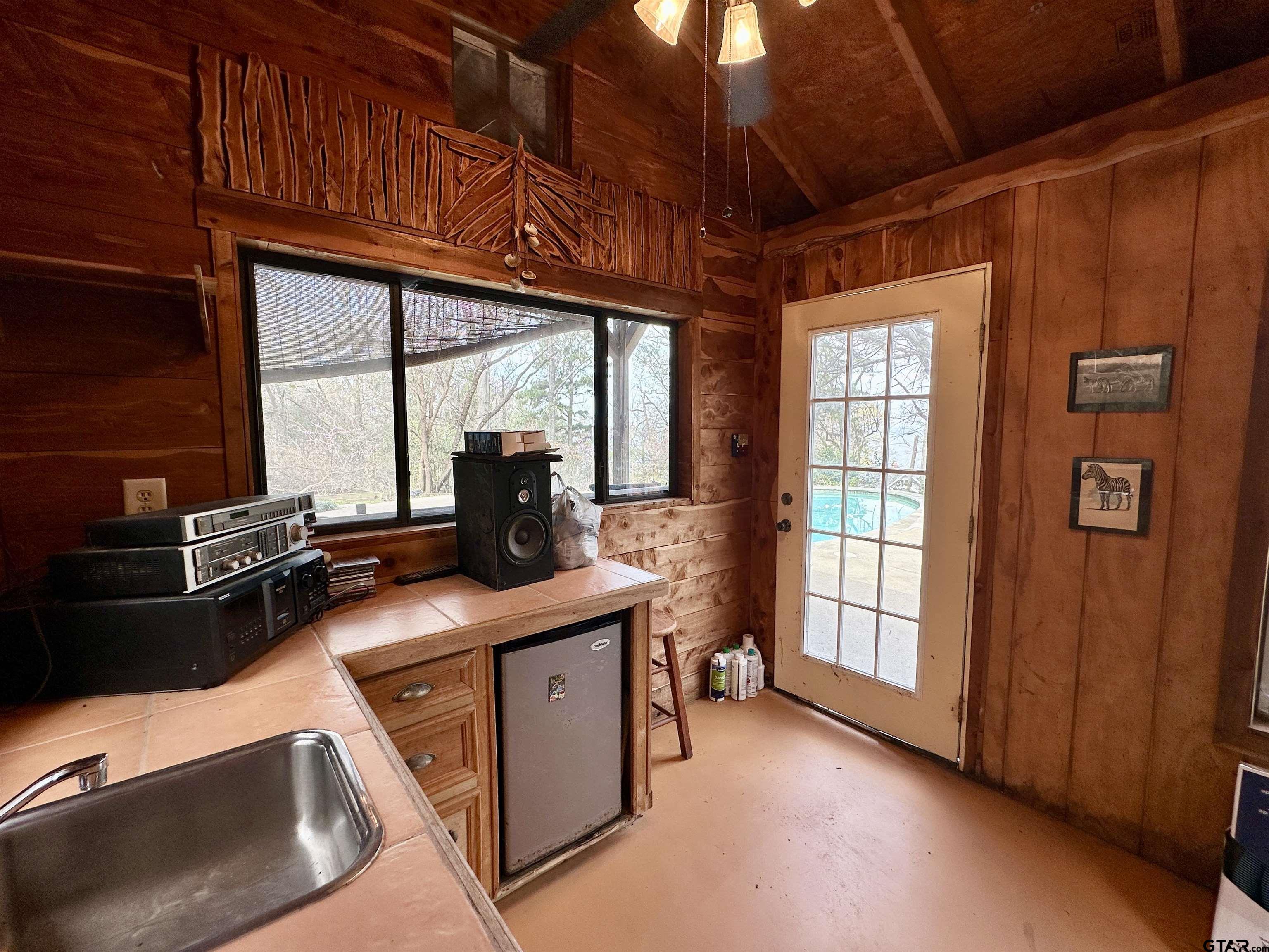 17035 Deer Run Road Flint, TX 75762 - Photo 23 of 31 a kitchen with stainless steel appliances granite countertop a sink a stove and a wooden cabinets