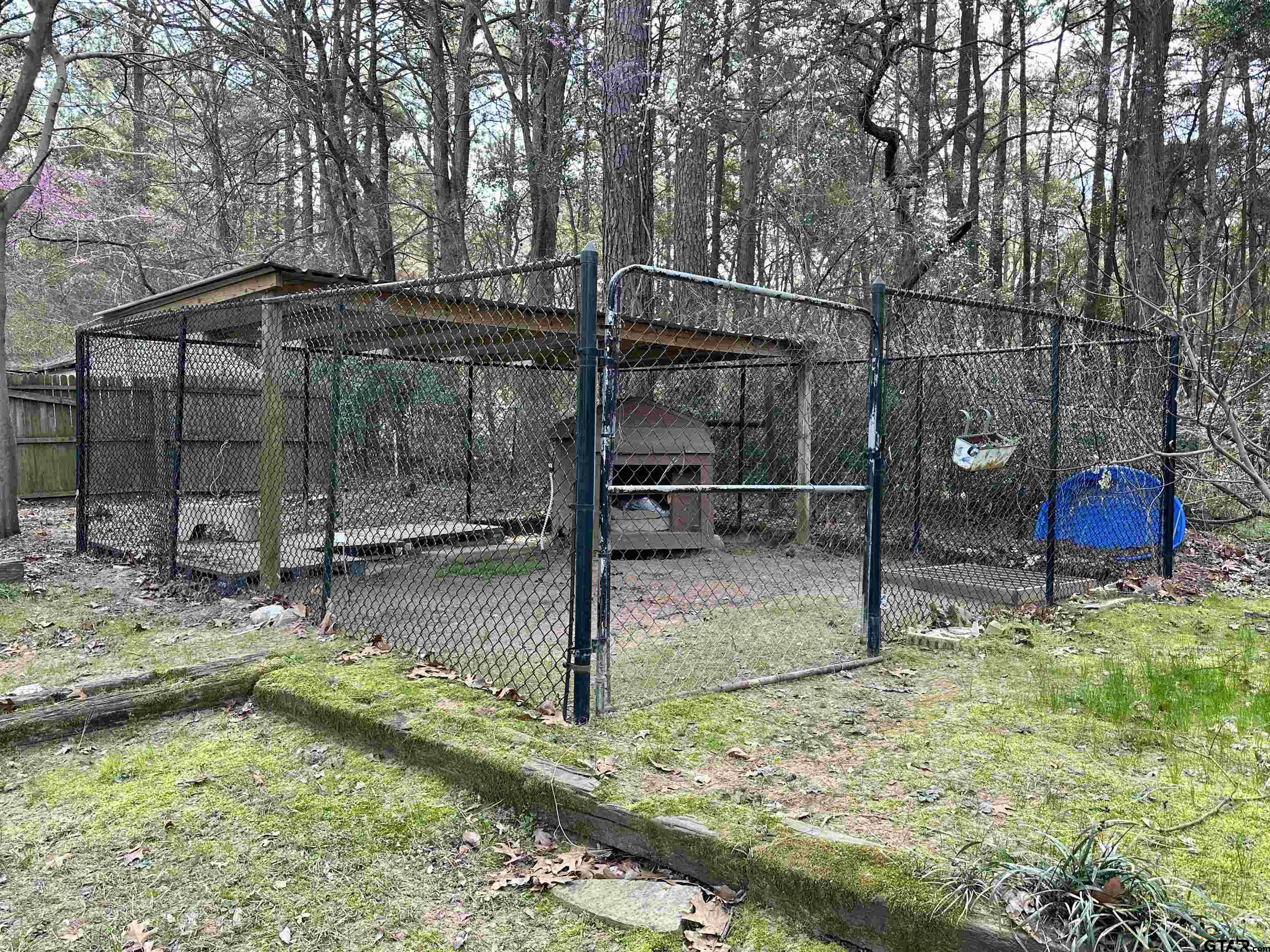 17035 Deer Run Road Flint, TX 75762 - Photo 29 of 31 a backyard of a house with water fountain and porch