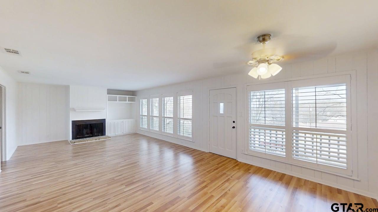 17035 Deer Run Road Flint, TX 75762 - Photo 3 of 31 a view of an empty room with wooden floor and a window