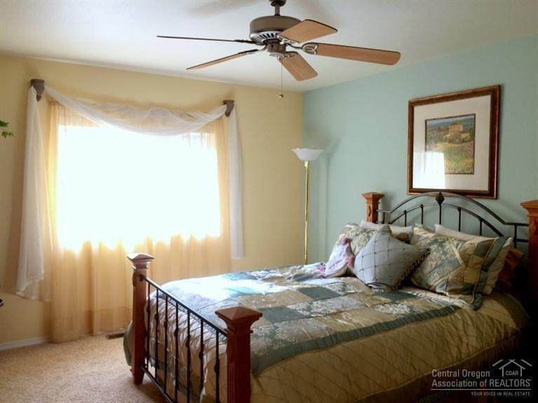 55739 Swan Road Bend, OR 97707 - Photo 14 of 25 Large master bedroom with ceiling fan an