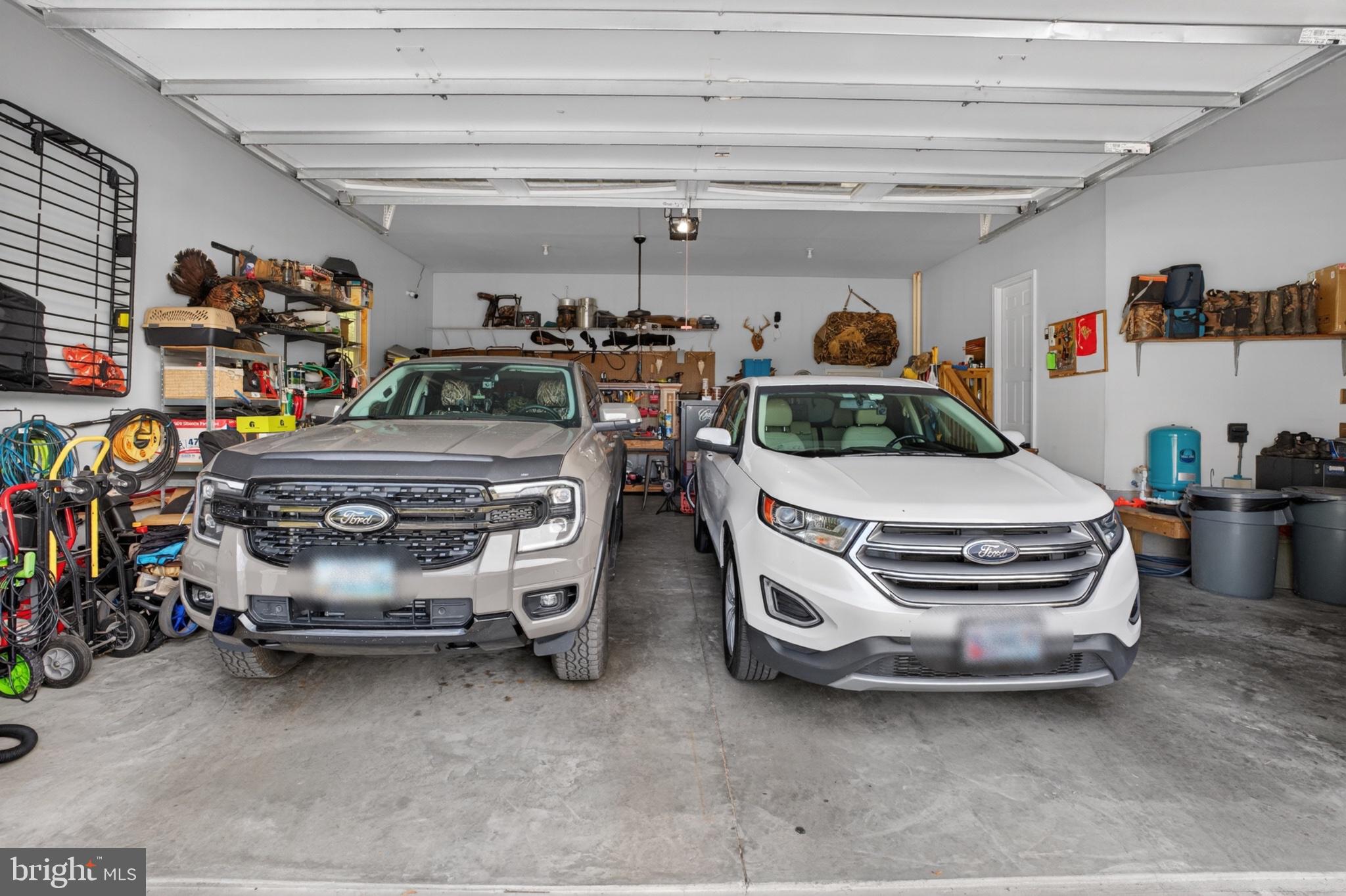 2435 Payne Road Pocomoke City, MD 21851 - Photo 63 of 75 Spacious garage with two Ford vehicles.