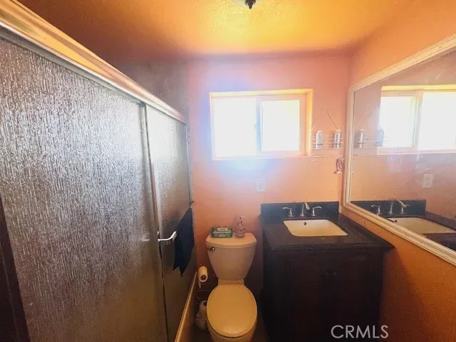 a bedroom with furniture and a bed