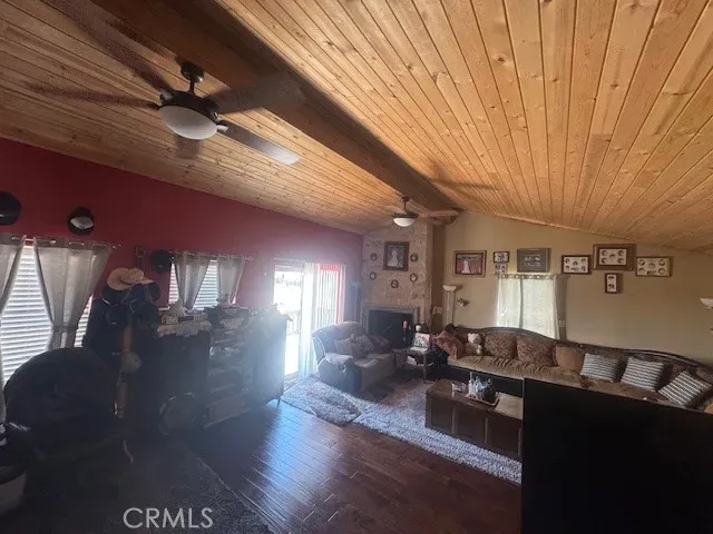 a view of a balcony with wooden floor and outdoor space
