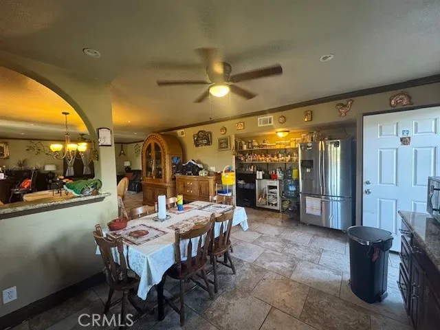 a dining room with a table and chairs