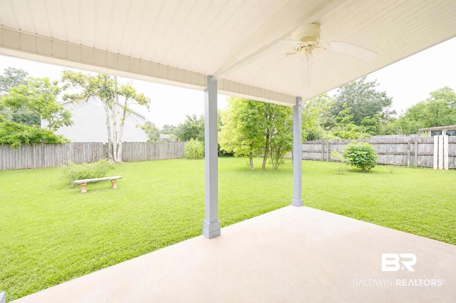 614 East Gate Circle Foley, AL 36535 - Photo 27 of 31 Covered patio with a ceiling fan, concrete flooring, and light blue support columns