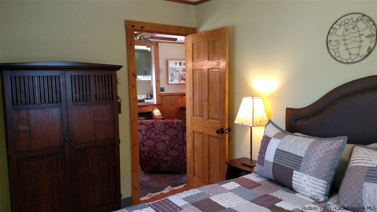 148 Pantherkill Road Phoenicia, NY 12464 - Photo 15 of 23 a bedroom with a bed and a mirror