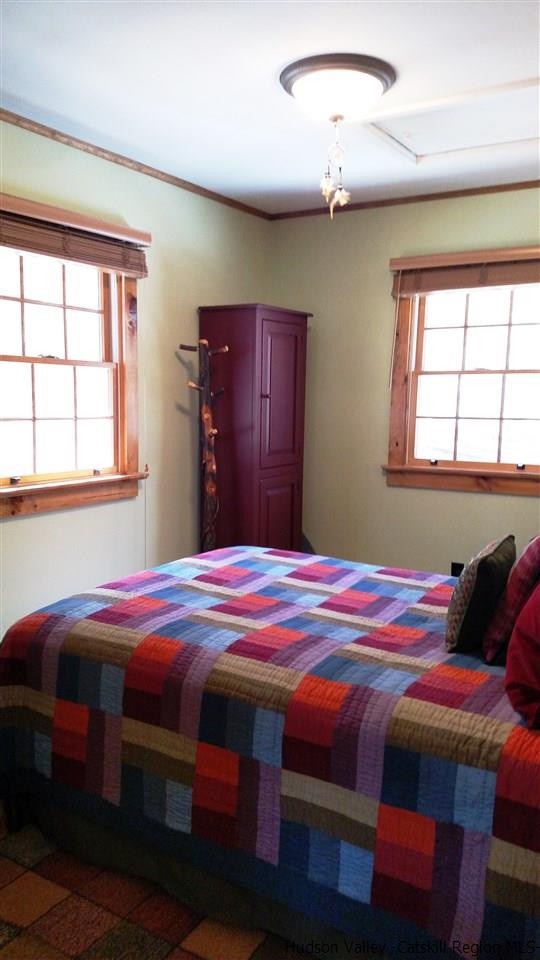 148 Pantherkill Road Phoenicia, NY 12464 - Photo 16 of 23 a bedroom with a bed and a window