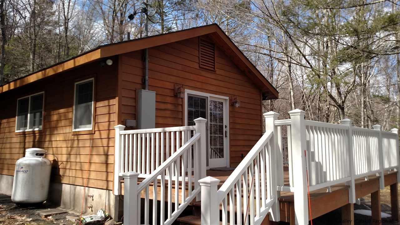 148 Pantherkill Road Phoenicia, NY 12464 - Photo 2 of 23 a view of a house with backyard and wooden fence