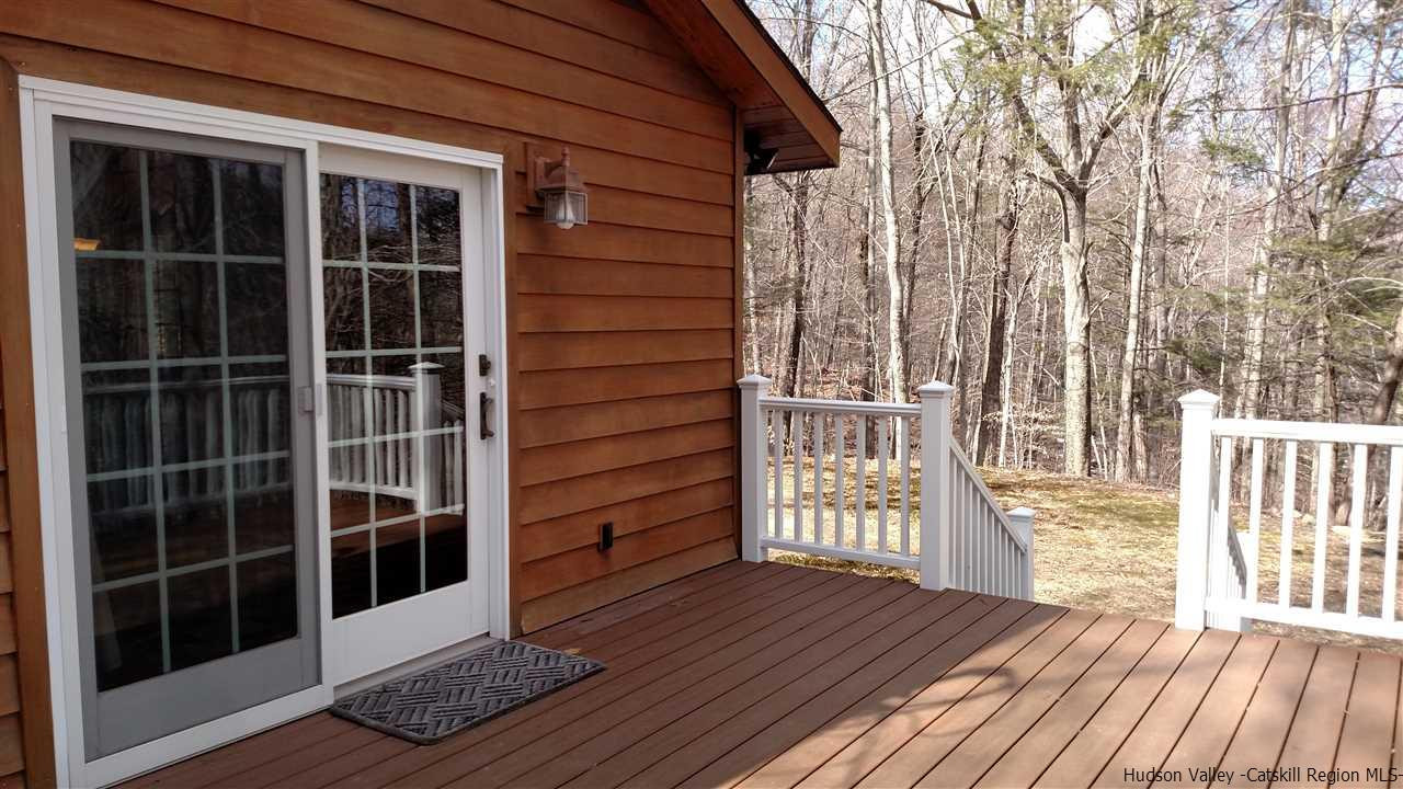 148 Pantherkill Road Phoenicia, NY 12464 - Photo 5 of 23 a view of front door deck and wooden floor