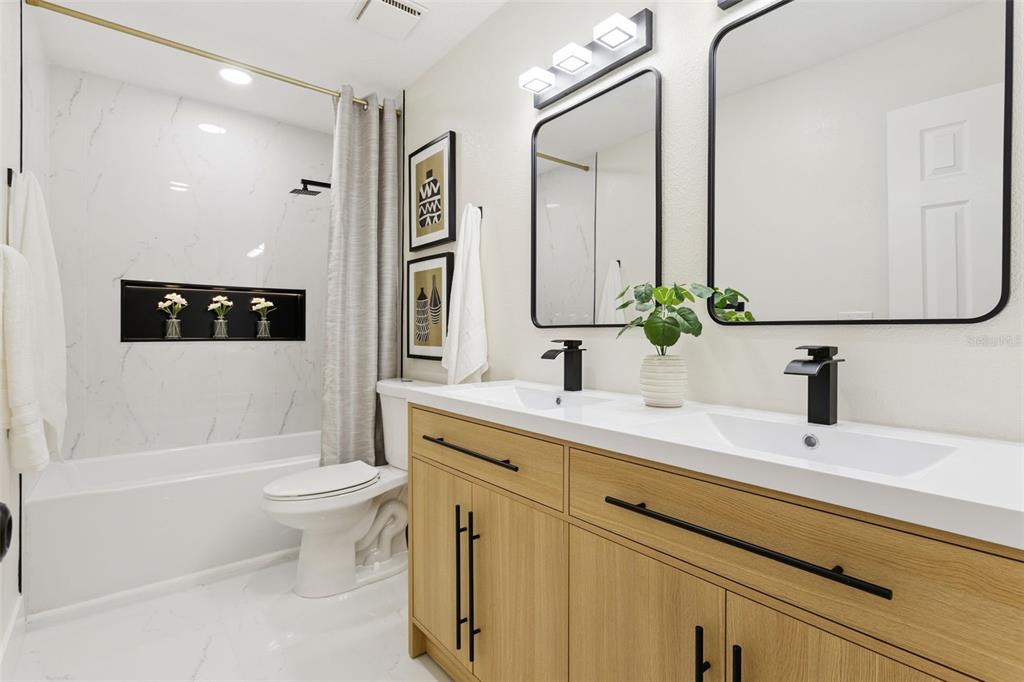 407 Forest Road Mount Dora, FL 32757 - Photo 19 of 35 a bathroom with a sink a toilet and shower