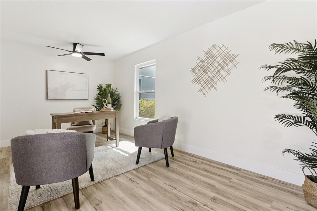 407 Forest Road Mount Dora, FL 32757 - Photo 21 of 35 a living room with furniture and a potted plant