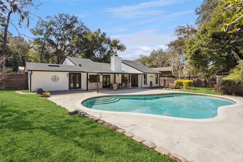 407 Forest Road Mount Dora, FL 32757 - Photo 25 of 35 a front view of a house with a yard