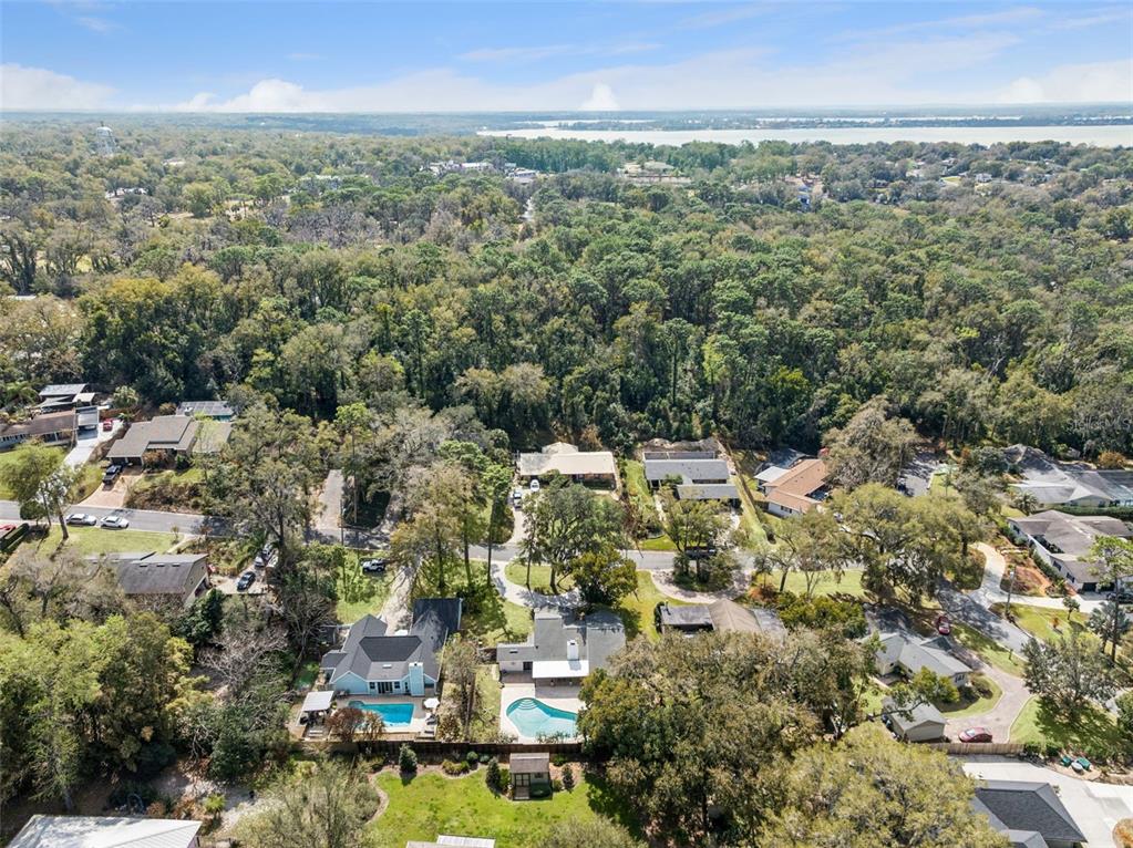 407 Forest Road Mount Dora, FL 32757 - Photo 29 of 35 an aerial view of multiple house