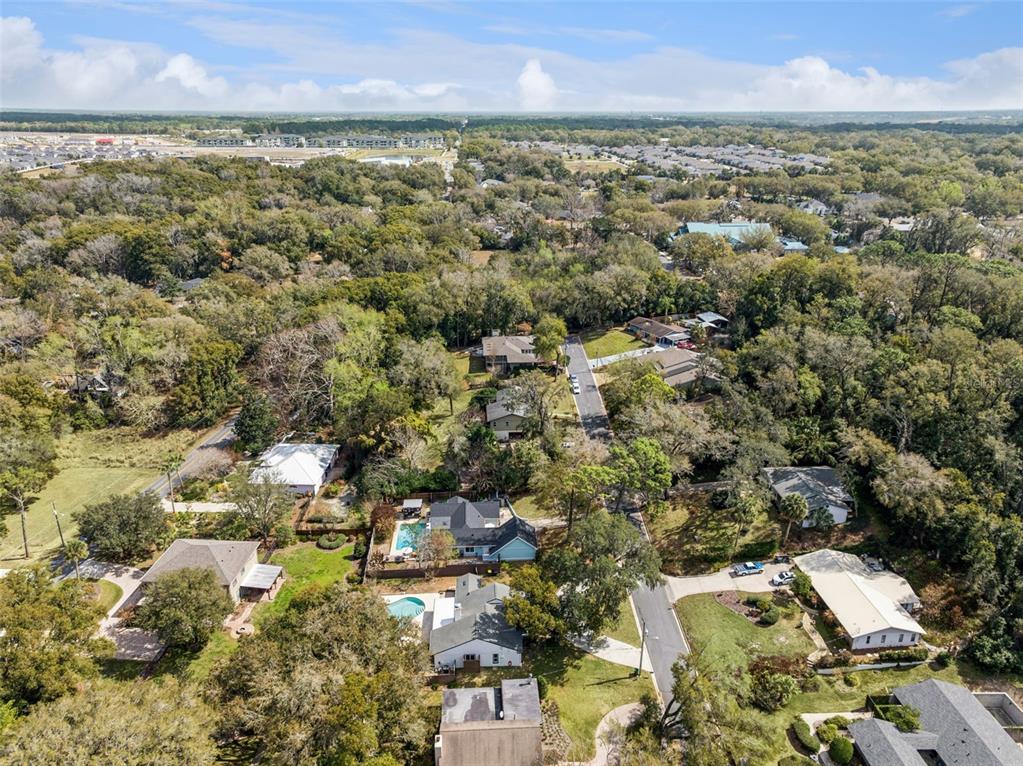 407 Forest Road Mount Dora, FL 32757 - Photo 32 of 35 an aerial view of residential houses with outdoor space