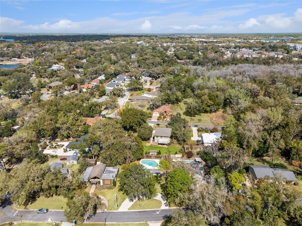 407 Forest Road Mount Dora, FL 32757 - Photo 34 of 35 an aerial view of residential building with green space