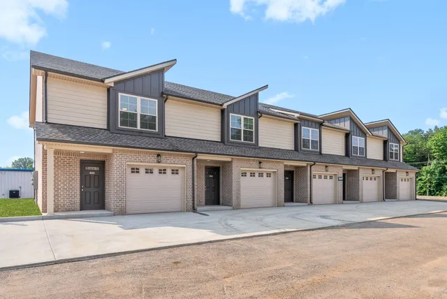 a front view of a house with a garage