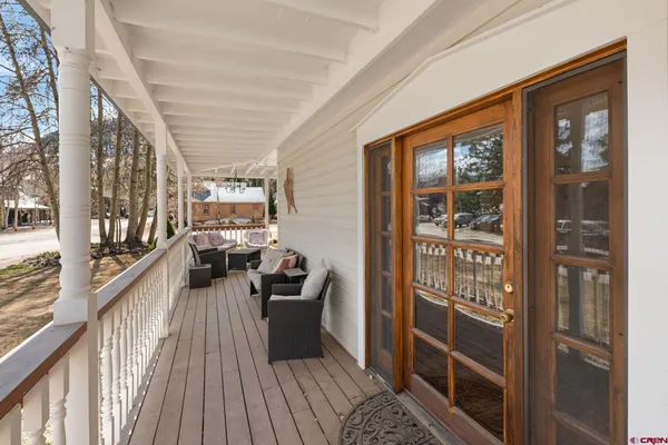 a view of a balcony and chairs