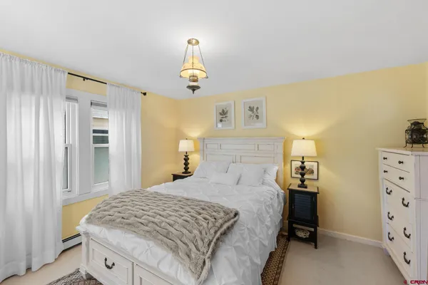 a bedroom with a bed and cabinets