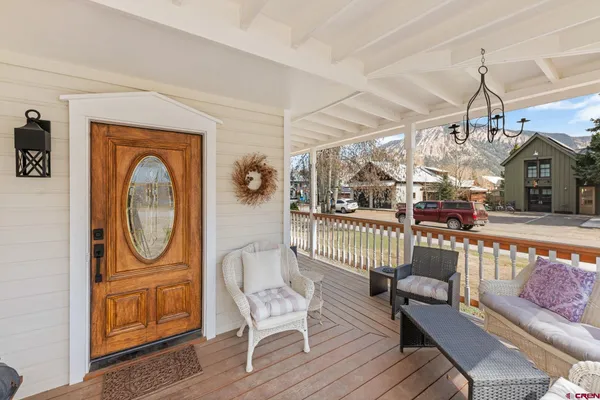 a view of a livingroom with furniture and a window