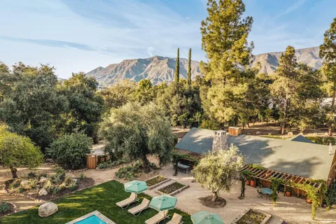 a view of a backyard of a house with a yard
