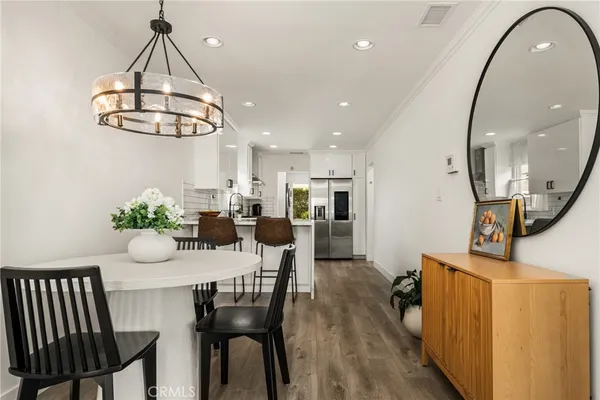 a white stove top oven sitting inside of a kitchen