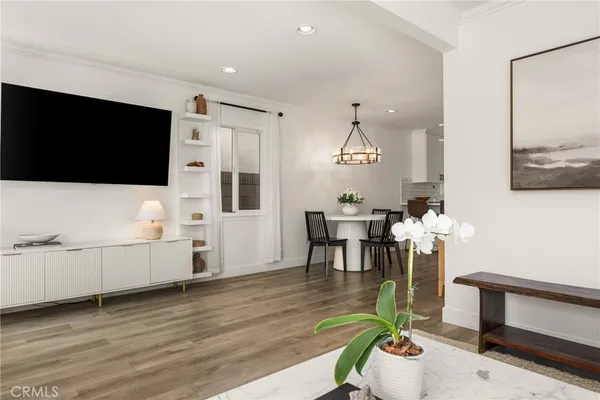 a kitchen with stainless steel appliances granite countertop a sink and a refrigerator
