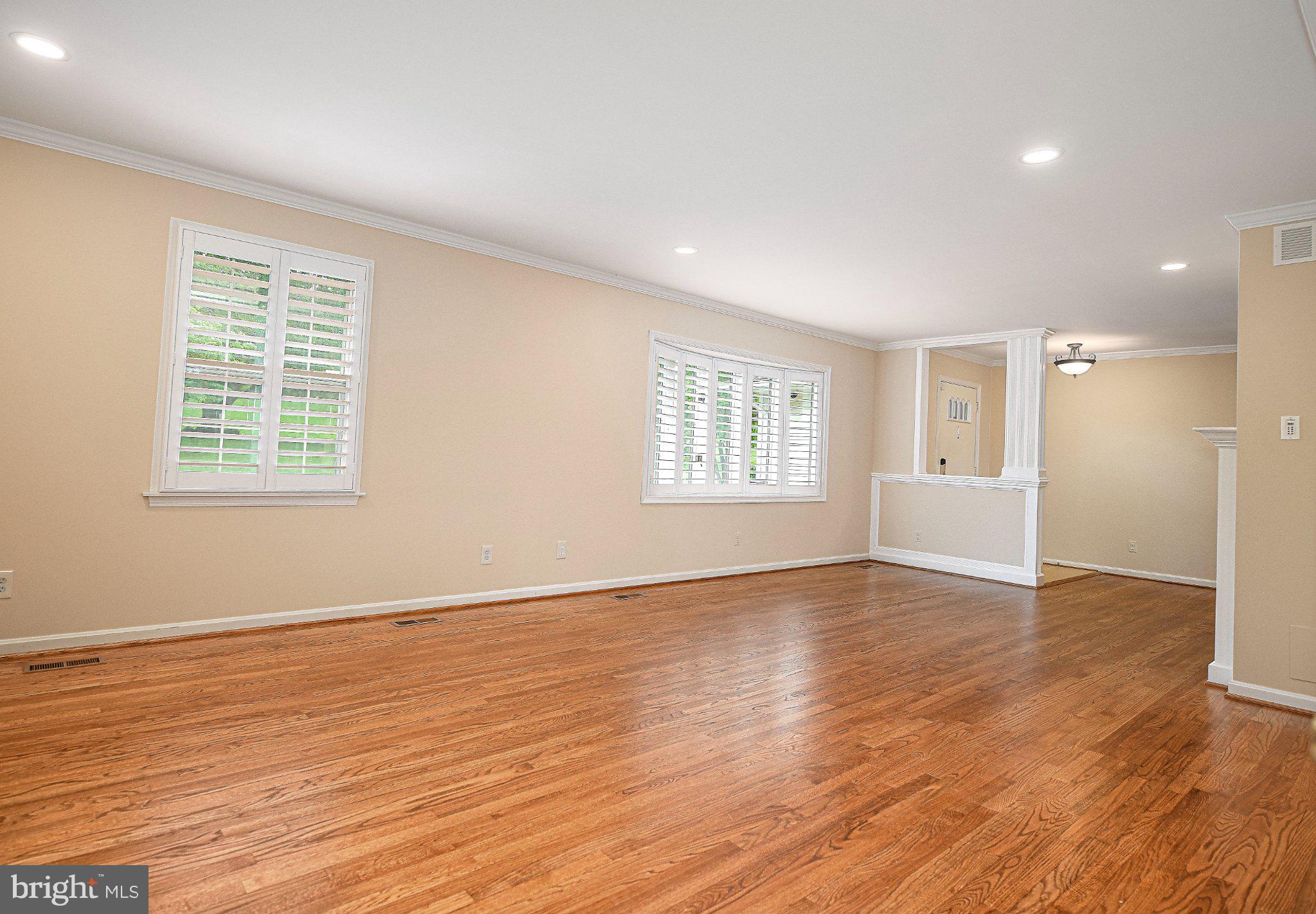 14300 Carroll Ridge Court Baldwin, MD 21013 - Photo 13 of 73 a view of an empty room with wooden floor and a window