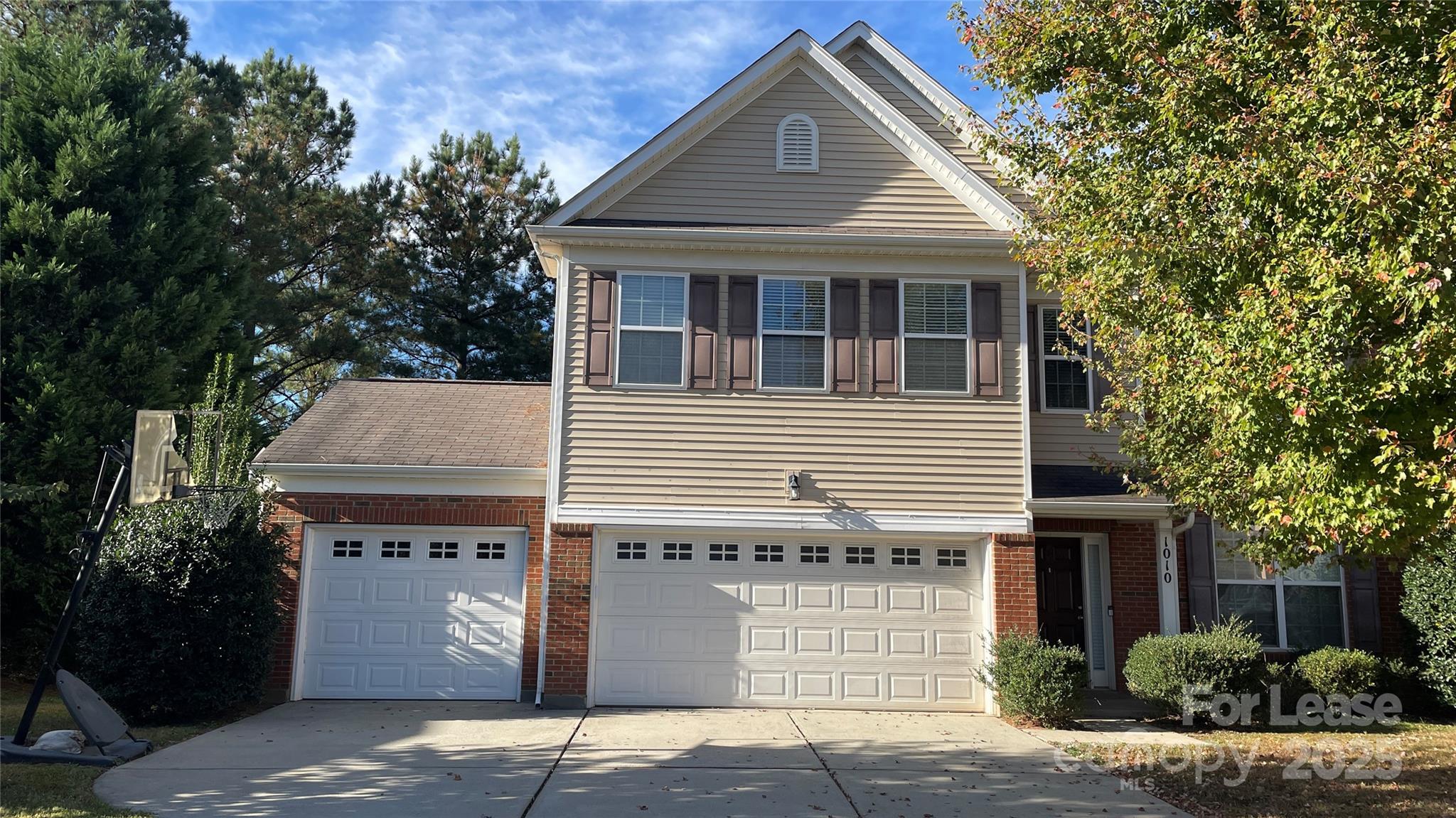 1010 Ashbin Court Fort Mill, SC 29707 - Photo 1 of 23 a front view of a house with a garden