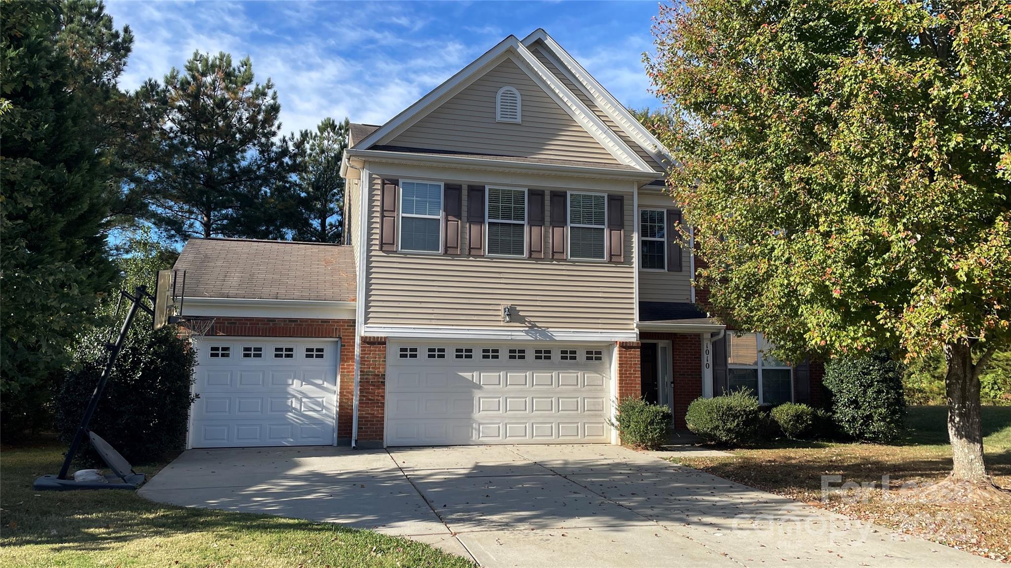 1010 Ashbin Court Fort Mill, SC 29707 - Photo 2 of 23 a front view of a house with a yard and garage