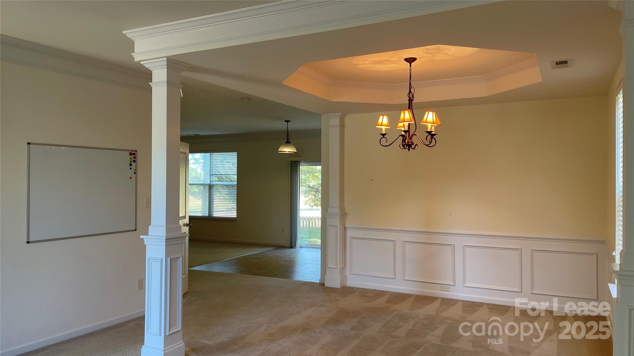 1010 Ashbin Court Fort Mill, SC 29707 - Photo 4 of 23 wooden floor in an empty room with a mirror