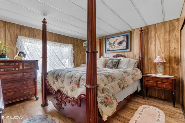 a bedroom with a bed and with furniture