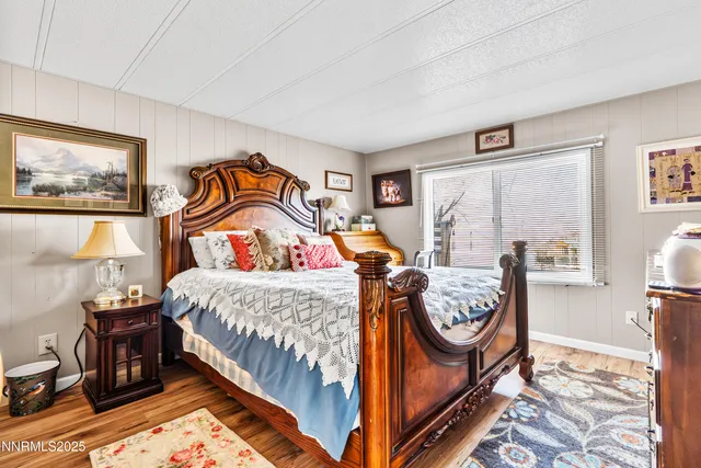 a bedroom with bed and a window