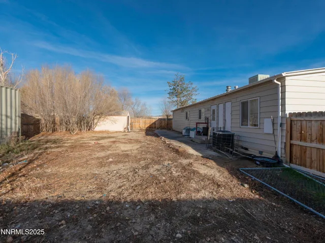 a house view with a backyard space