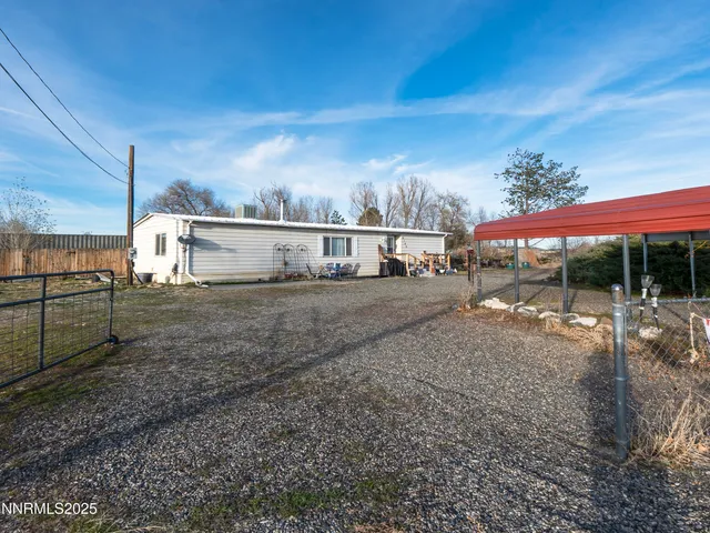a view of a street with a building in the background