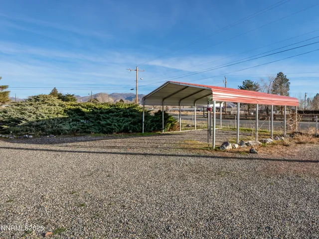 a view of a tiny house with a yard