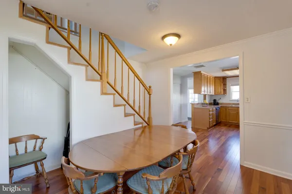 a view of kitchen and dining room with furniture wooden floor and a kitchen