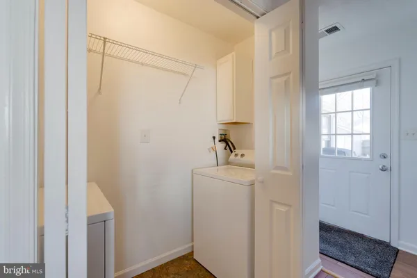 a bathroom with a shower a sink and a mirror
