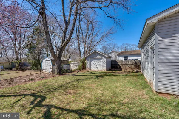 a house with trees in the background