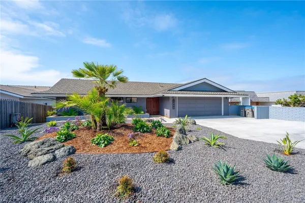 a front view of house with a yard
