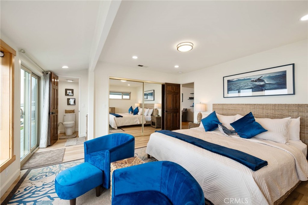 4865 Windsor Boulevard Cambria, CA 93428 - Photo 11 of 45 a bedroom with furniture and a large window