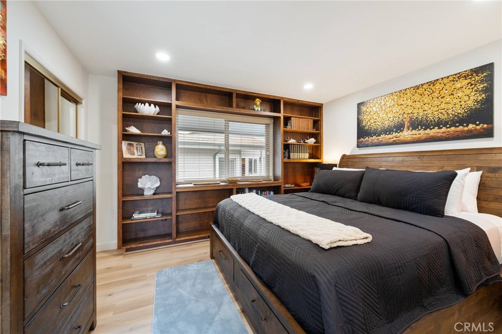 4865 Windsor Boulevard Cambria, CA 93428 - Photo 13 of 45 a bedroom with a bed and a dresser