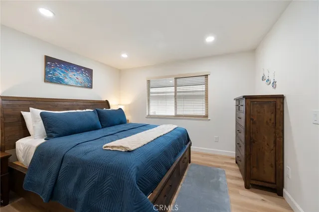 a dining room with furniture and a floor to ceiling window