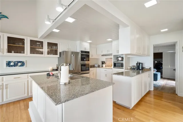 a view of outdoor space with wooden floor and a barbeque
