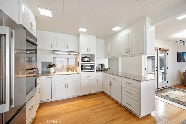 a view of a balcony with wooden floor