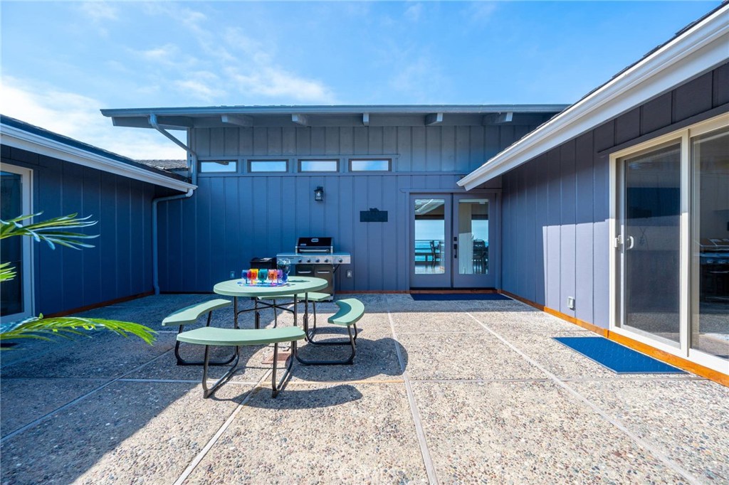 4865 Windsor Boulevard Cambria, CA 93428 - Photo 41 of 45 a view of a chairs and tables in the back yard of the house