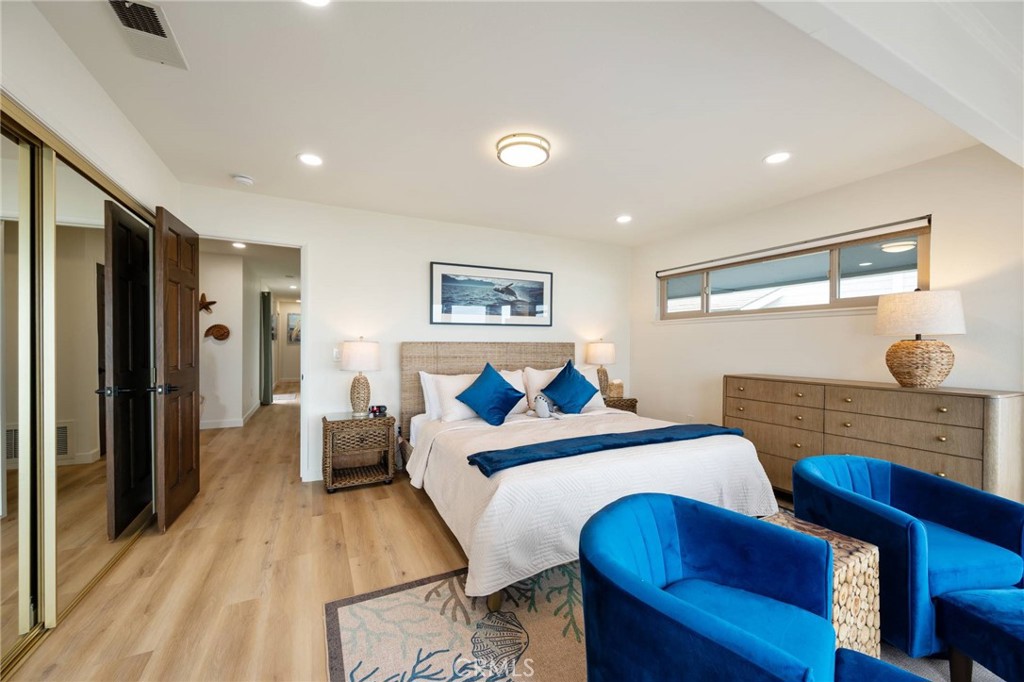 4865 Windsor Boulevard Cambria, CA 93428 - Photo 10 of 45 a bed room with a bed and a lamp