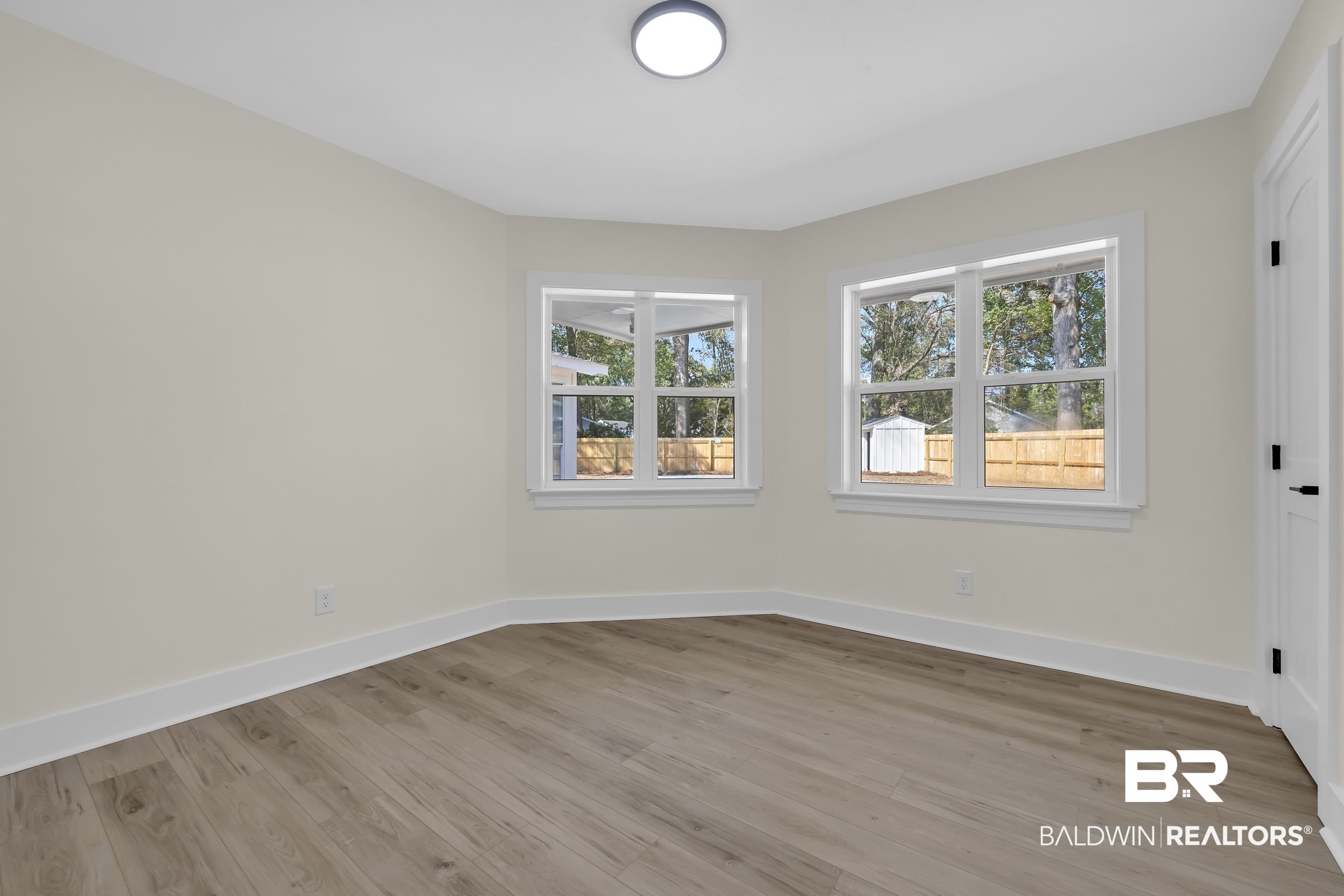 1409 Altair Lane Mobile, AL 36693 - Photo 15 of 23 Empty room with baseboards and light wood finished floors