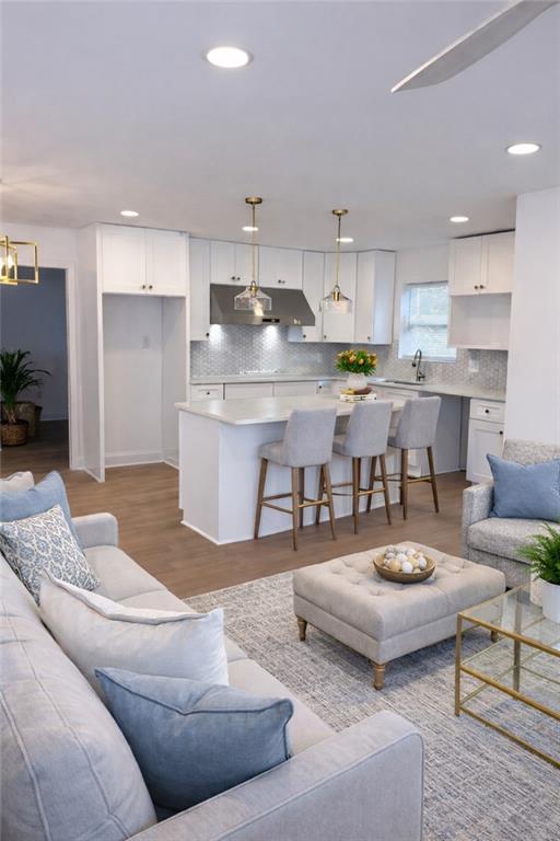3687 Clovis Court Northwest Atlanta, GA 30331 - Photo 5 of 8 a living room with stainless steel appliances kitchen island granite countertop furniture and a view of kitchen