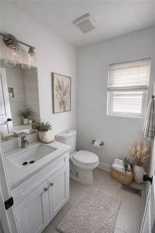 3687 Clovis Court Northwest Atlanta, GA 30331 - Photo 7 of 8 a bathroom with a toilet sink and mirror